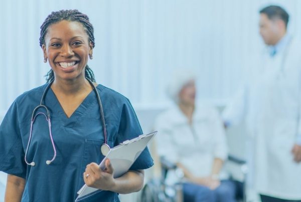 Nurse advocating how their patient with a doctor in the background.